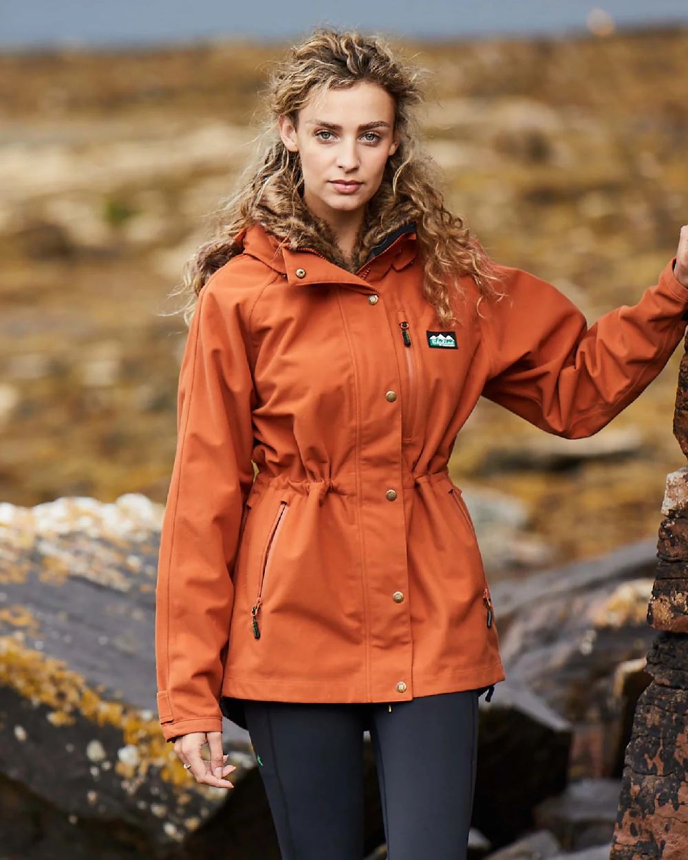 Autumn coloured Ridgeline Ladies Monsoon II Arctic Jacket Autumn Edition on rock background 