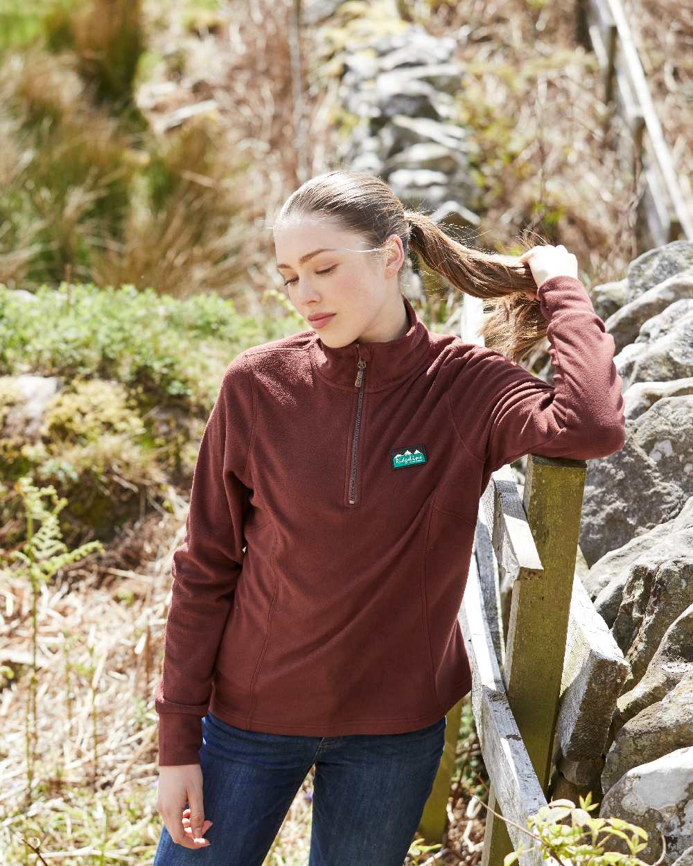 Oxblood coloured Ridgeline Ladies Narvik Fleece on farm background 