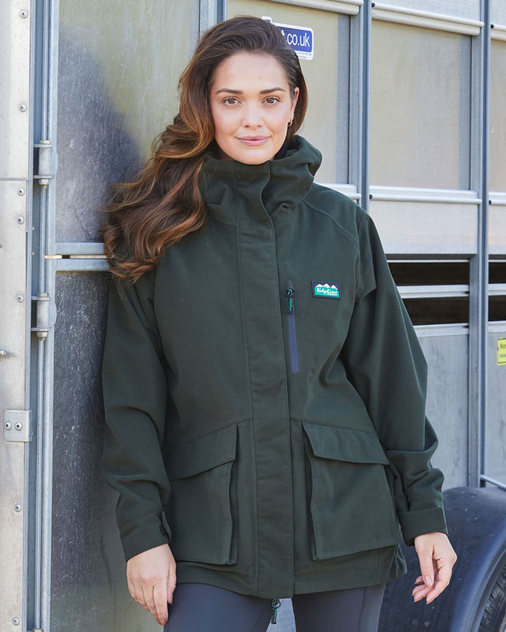 Deep Forest Coloured Ridgeline Ladies Rhea Jacket on outdoor background 