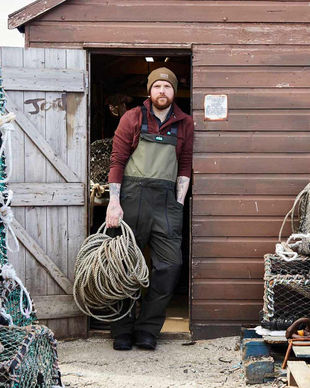 Deep Forest coloured Ridgeline Mens Agri Pro Bib &amp; Brace on dock background 