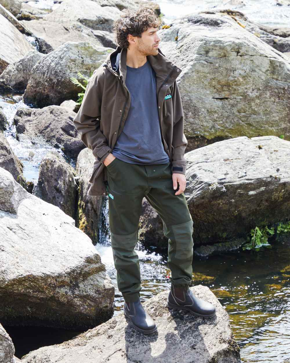Deep Forest coloured Ridgeline Mens Cambrian Trousers on mountain background 