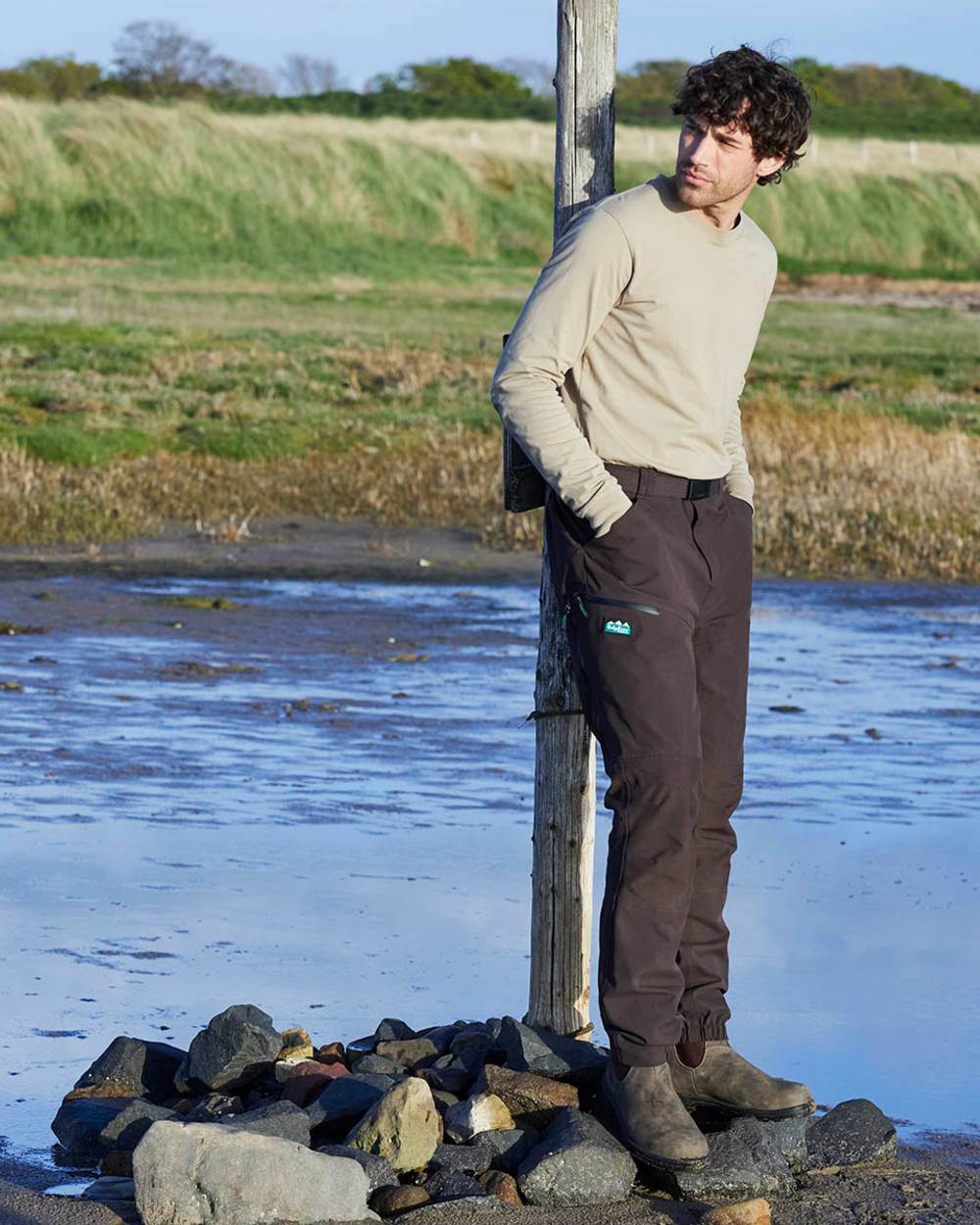 Deep Bark coloured Ridgeline Mens Grafter Trousers on river background 