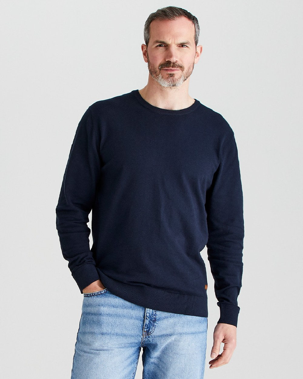 Navy coloured Ridgeline Mens Hartland Crew Knit Jumper on grey background 