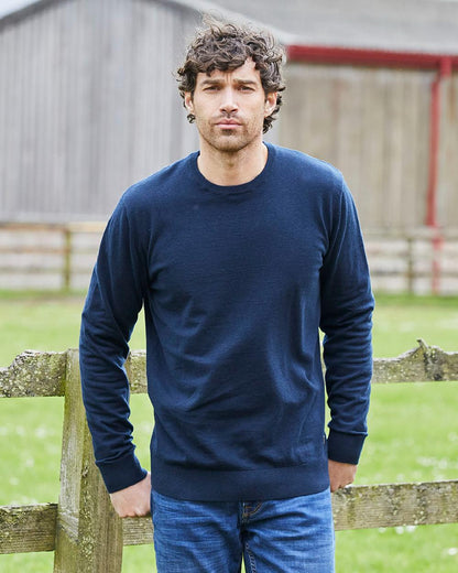 Navy coloured Ridgeline Mens Hartland Crew Knit Jumper on farm background 