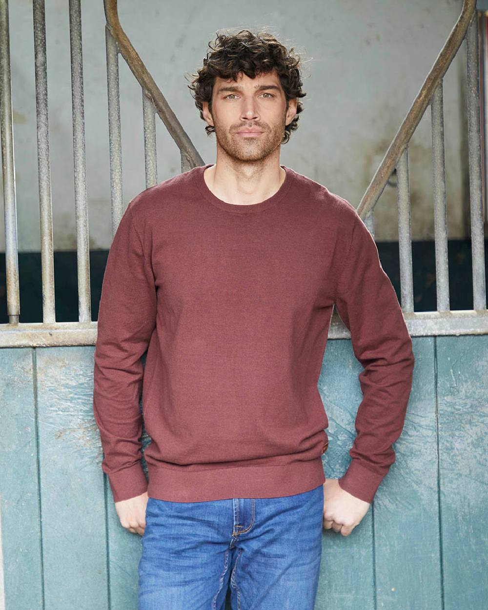 Oxblood coloured Ridgeline Mens Hartland Crew Knit Jumper on barn background 