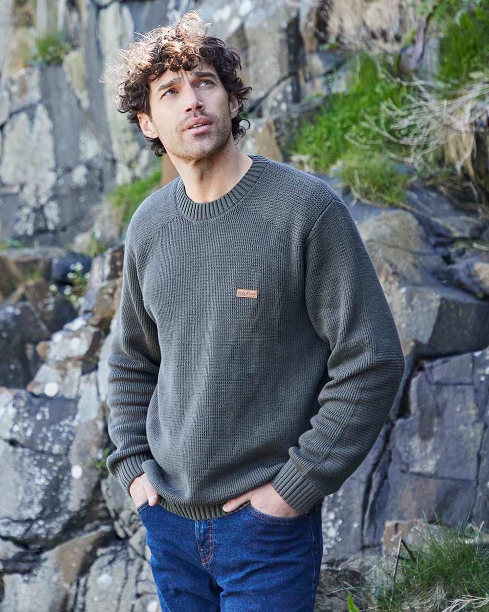 Moss coloured Ridgeline Mens Journeyman Knit Jumper on shore background 