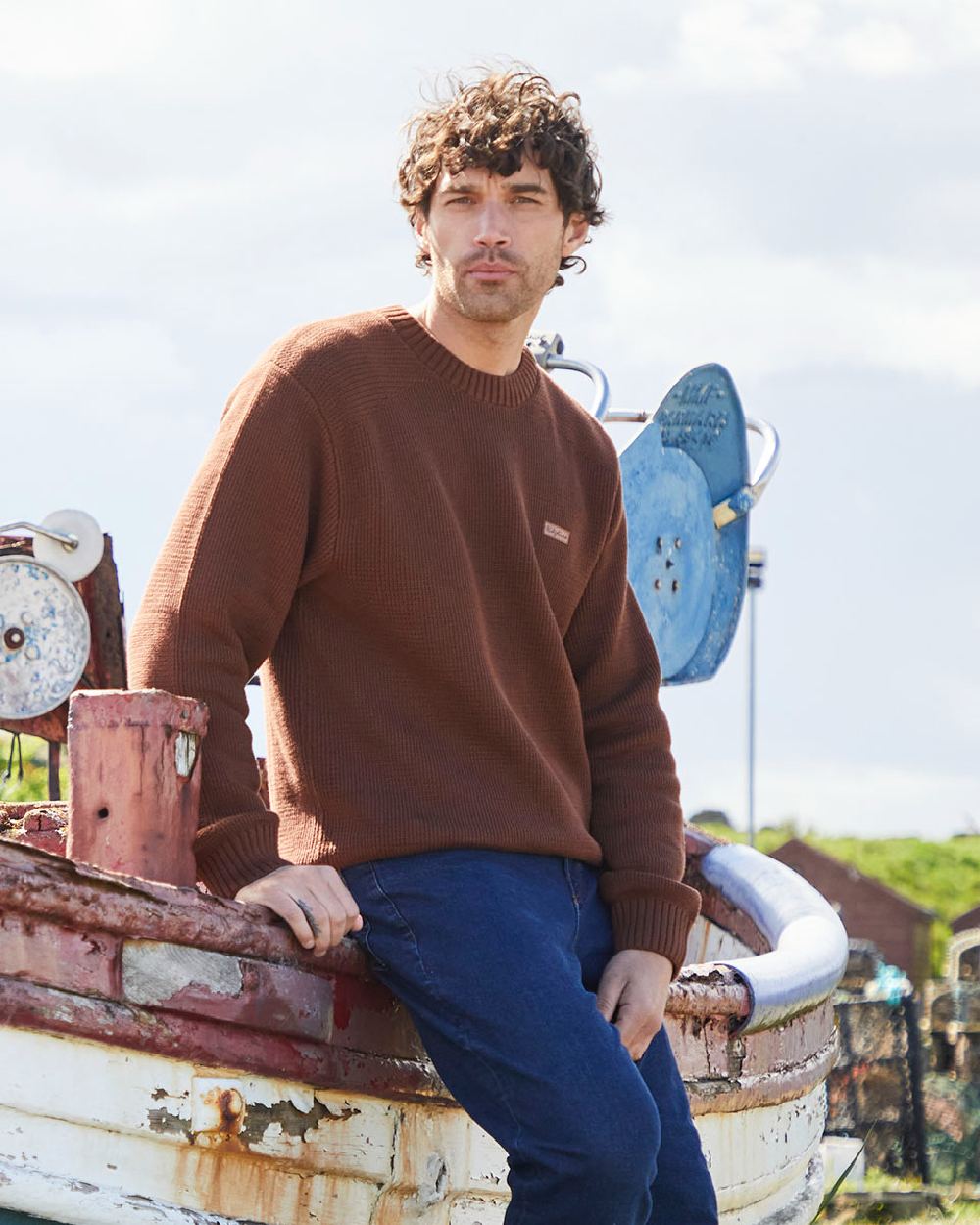 Nutmeg coloured Ridgeline Mens Journeyman Knit Jumper on shore background 