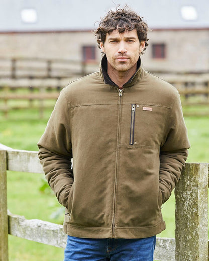 Moody Teak coloured Ridgeline Mens Montana Work Coat on farm background 