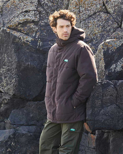 Deep Bark coloured Ridgeline Mens Tundra Thermal Jacket on shore background 