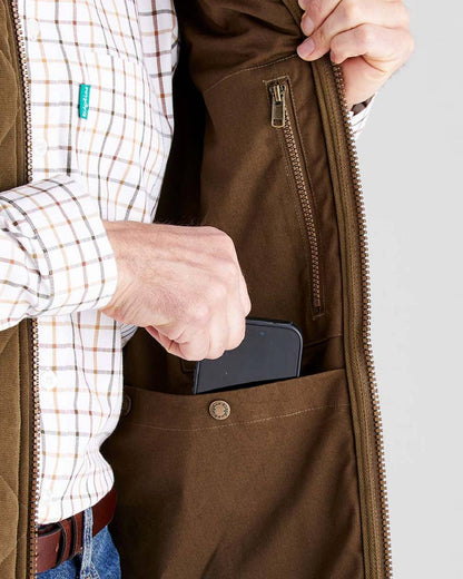 Moody Teak coloured Ridgeline Mens Wester Skeld Gilet on grey background 