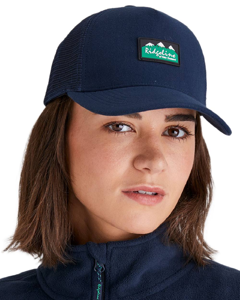 Navy Coloured Ridgeline Monsoon Trucker Cap on white background  