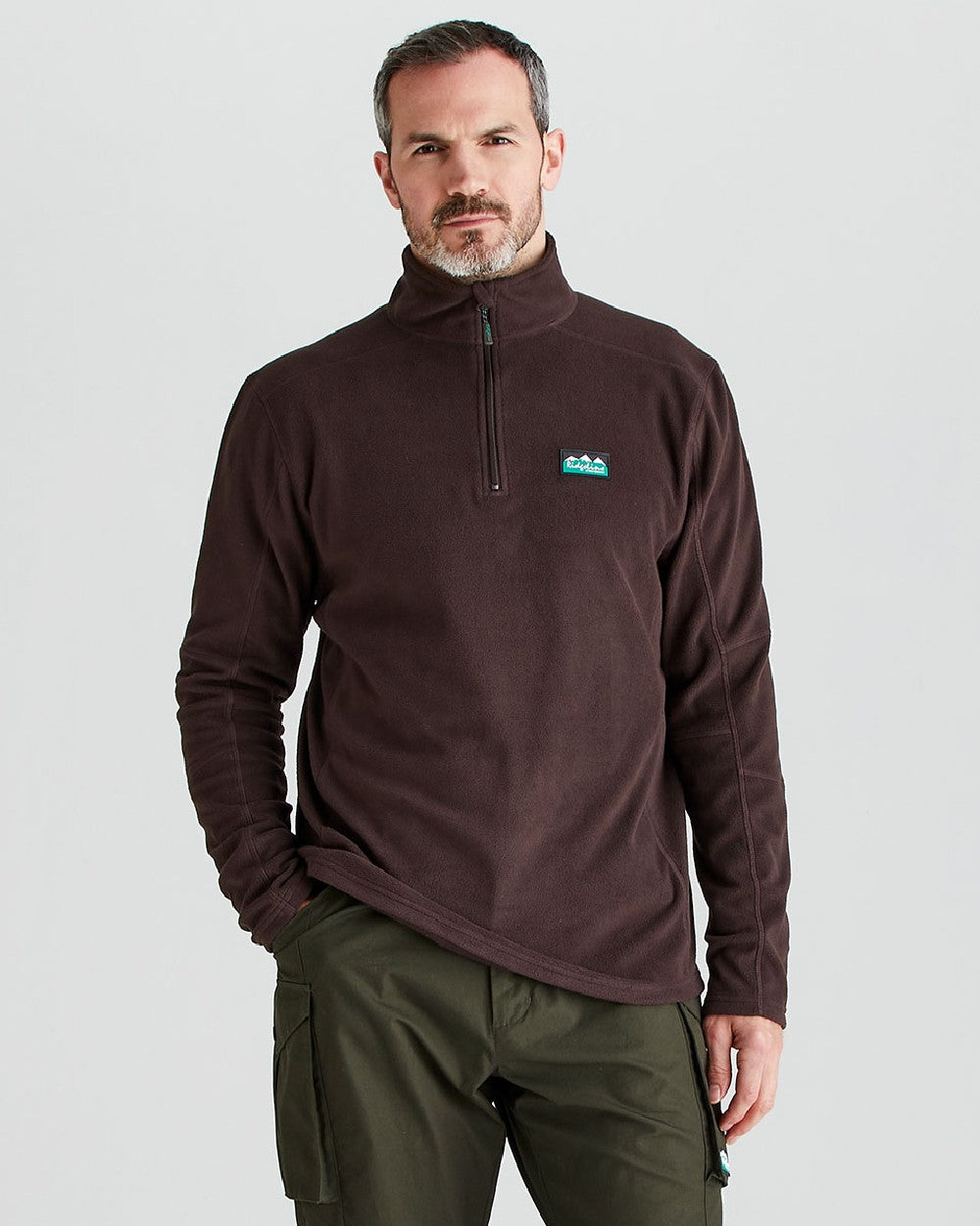 Deep Bark coloured Ridgeline Narvik Fleece on grey background 