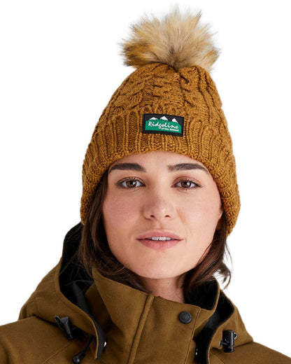 Ochre Coloured Ridgeline Nordic Fleck Bobble Hat on white background 
