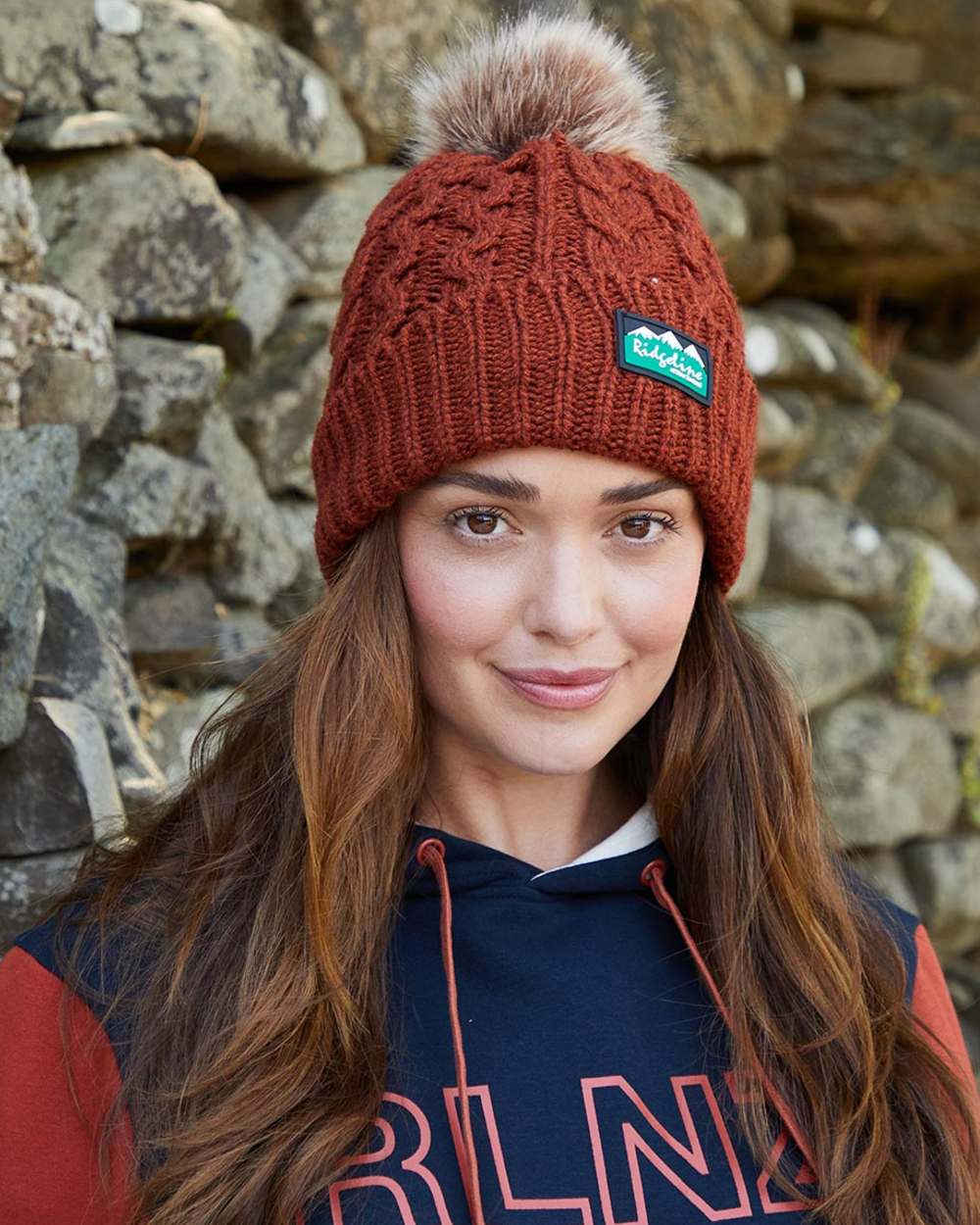 Russet Coloured Ridgeline Nordic Fleck Bobble Hat on outdoor background 