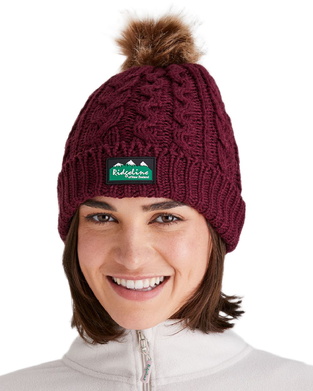 Winter Berry Coloured Ridgeline Nordic Fleck Bobble Hat on white background 