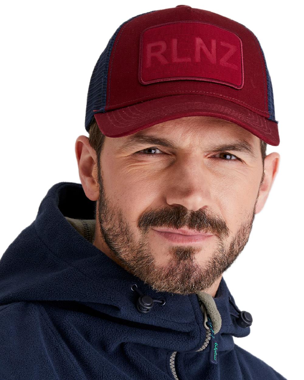 Rhubarb Coloured Ridgeline RLNZ Trucker Cap on white background 