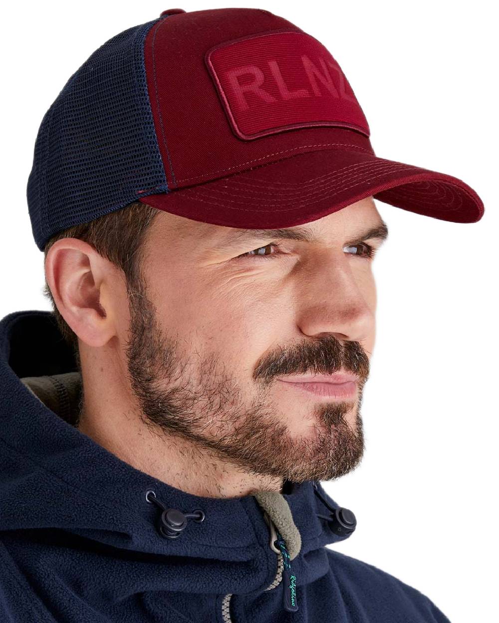 Rhubarb Coloured Ridgeline RLNZ Trucker Cap on white background 