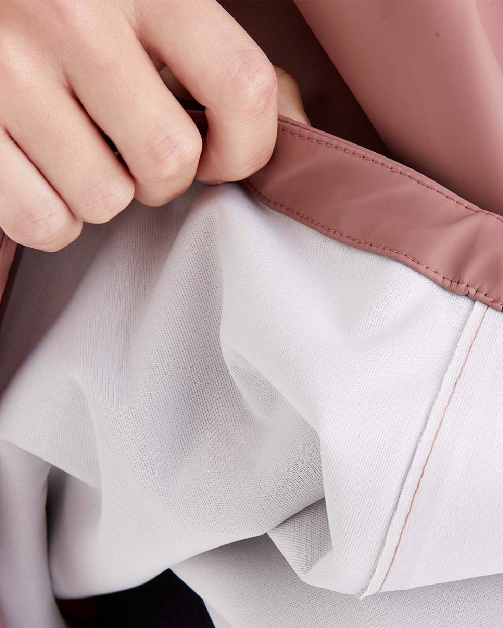 Dusky Pink Coloured Ridgeline Signature Poncho on white background 