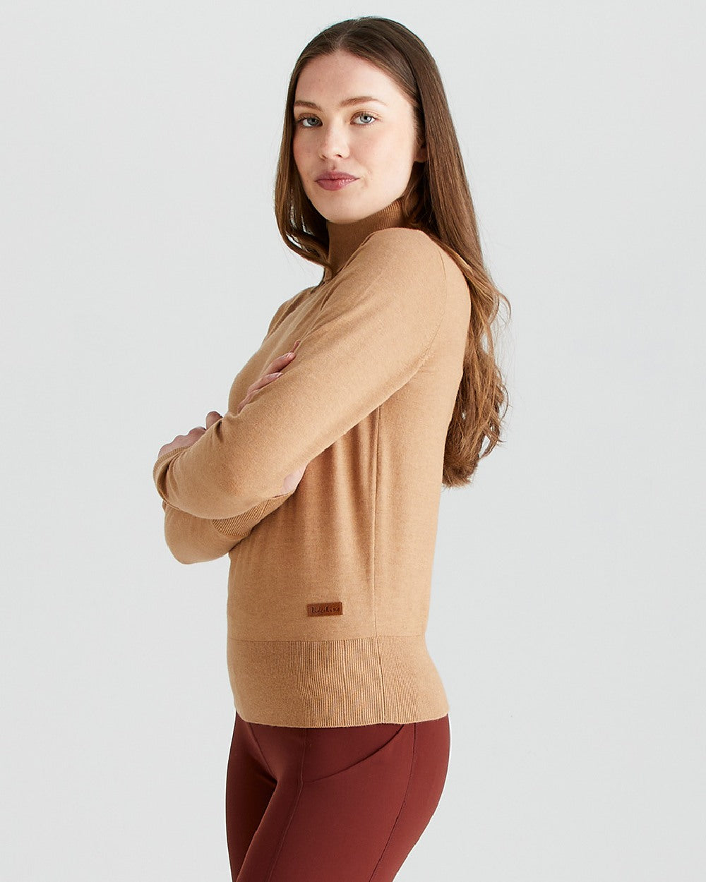 Sienna coloured Ridgeline Womens Melford Knit Roll Neck Jumper on grey background 
