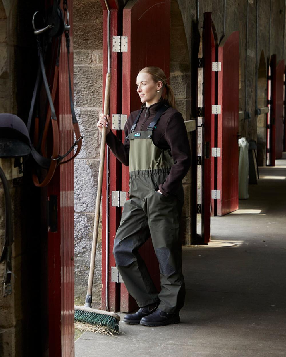 Deep Forest coloured Ridgeline Womens Agri Pro Bib &amp; Brace on stable background 