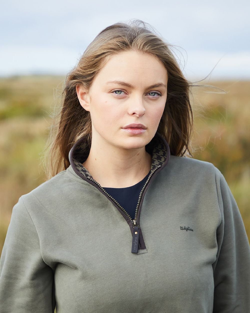 Smokey Olive Coloured Ridgeline Womens Brancaster Quarter Zip Top on outdoor background 