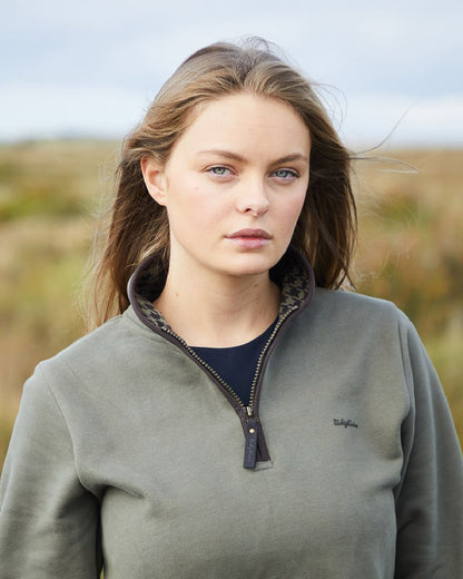 Smokey Olive Coloured Ridgeline Womens Brancaster Quarter Zip Top on outdoor background 