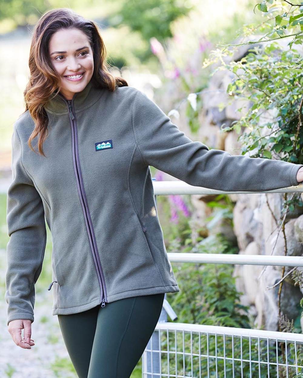 Ivy Green coloured Ridgeline Womens Brenna Fleece Jacket on mountain background 