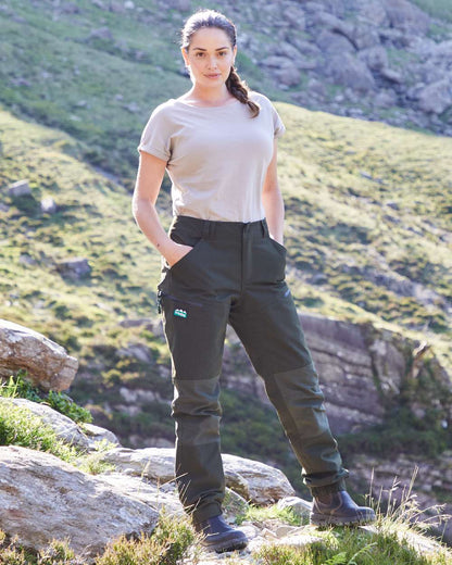 Deep Forest coloured Ridgeline Womens Cambrian Trousers on outdoor background 