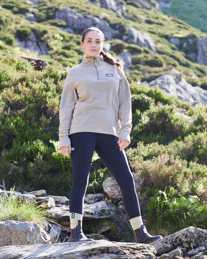 Navy coloured Ridgeline Womens Infinity Leggings on mountain background 