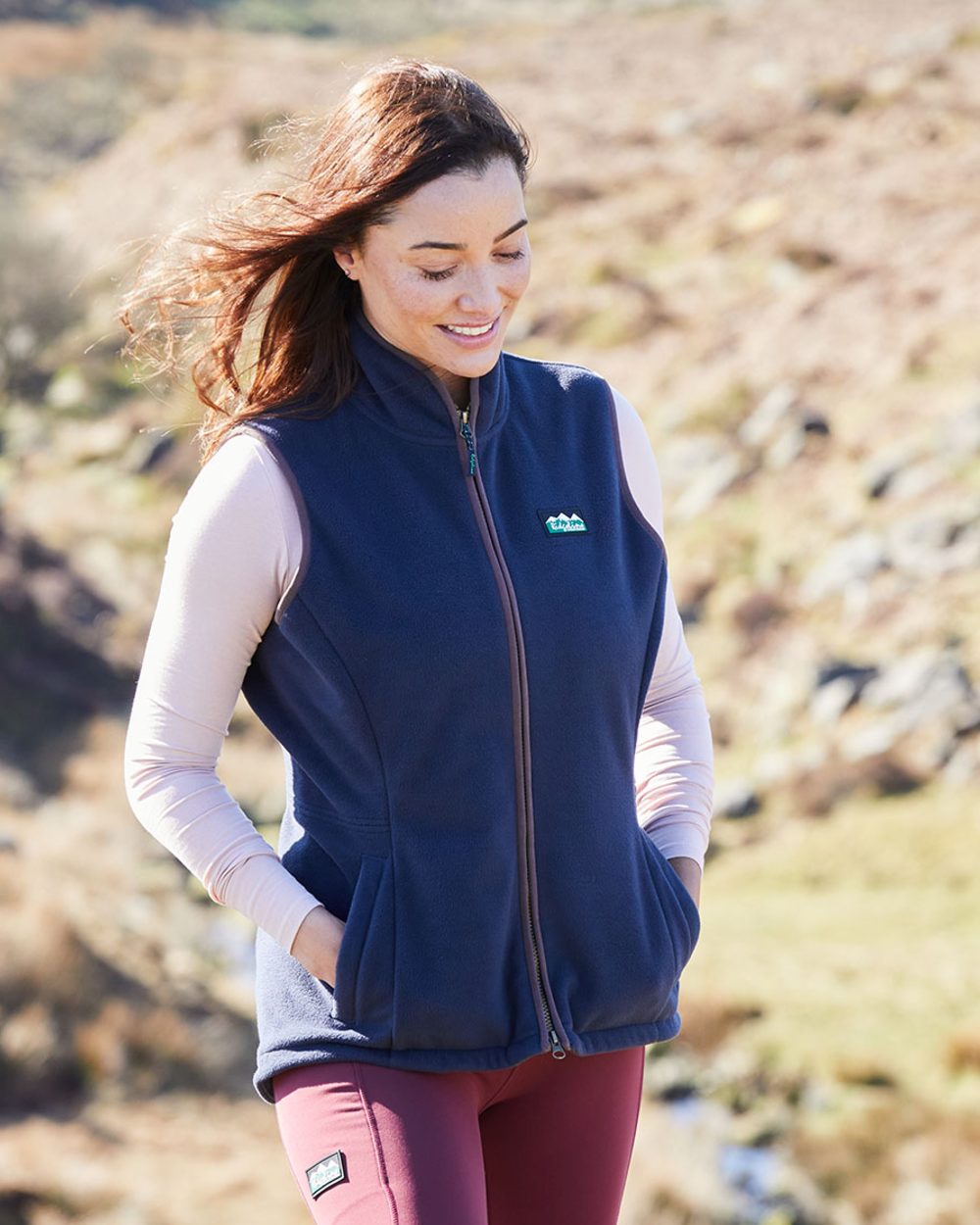 Navy coloured Ridgeline Womens Kodiak Gilet on mountain background 