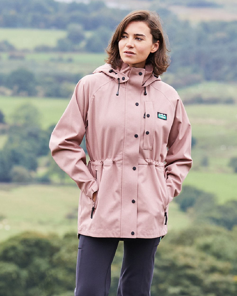 Dusky Pink Coloured Ridgeline Womens Monsoon Light Jacket on outdoor background 