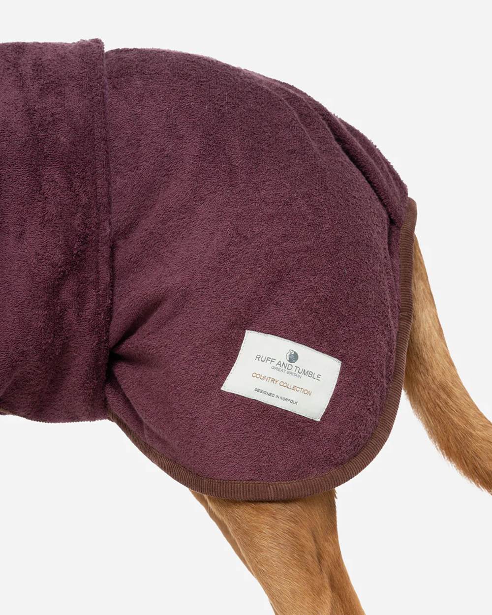 Burgundy coloured Ruff &amp; Tumble Country Dog Drying Coat on ginger dog on white background 