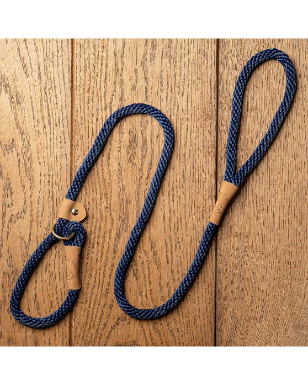 French Navy coloured Ruff &amp; Tumble Slip Dog Leads on wooden background 