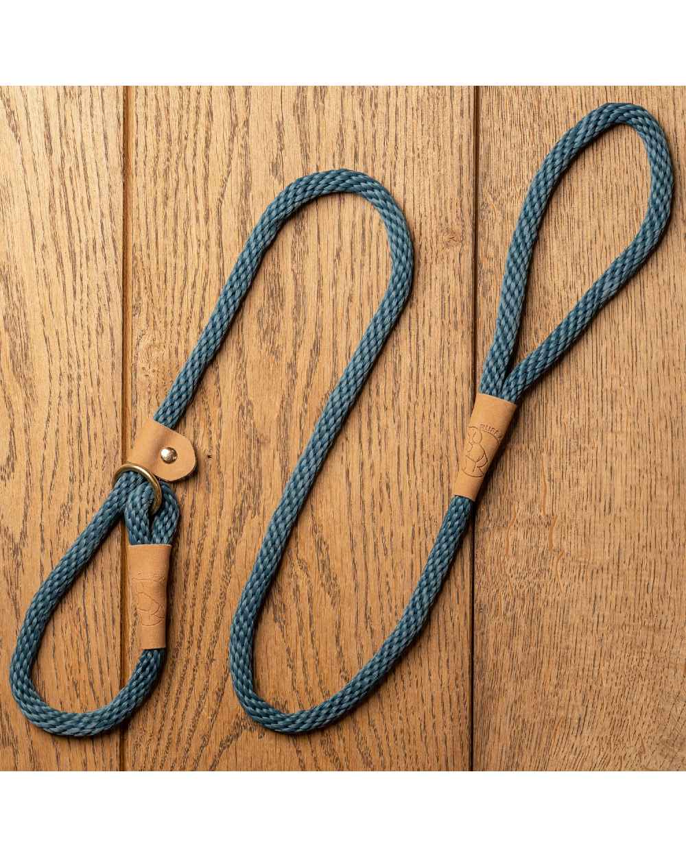 Sandringham Blue coloured Ruff &amp; Tumble Slip Dog Leads on wooden background 