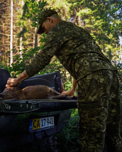 InVis Green Coloured Seeland Active Camo Long Sleeve T-Shirt on forest background 