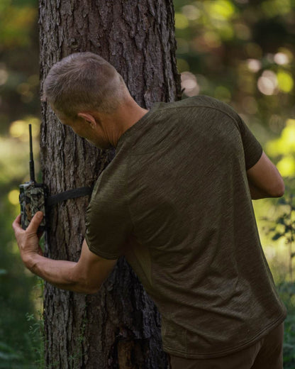 Pine Green Coloured Seeland Active Short Sleeve T-Shirt on forest background 