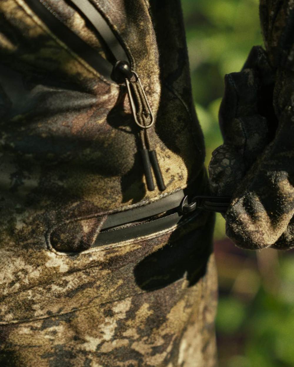 InVis Green Coloured Seeland Avail Camo Trousers on forest background 