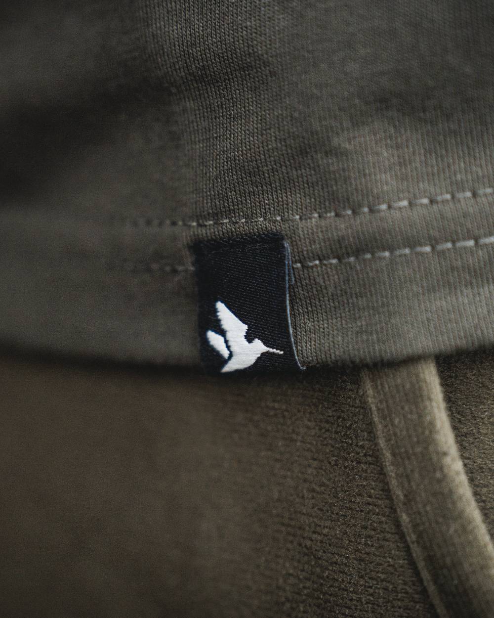 Pine Green coloured Seeland BGH T-Shirt on forest background 