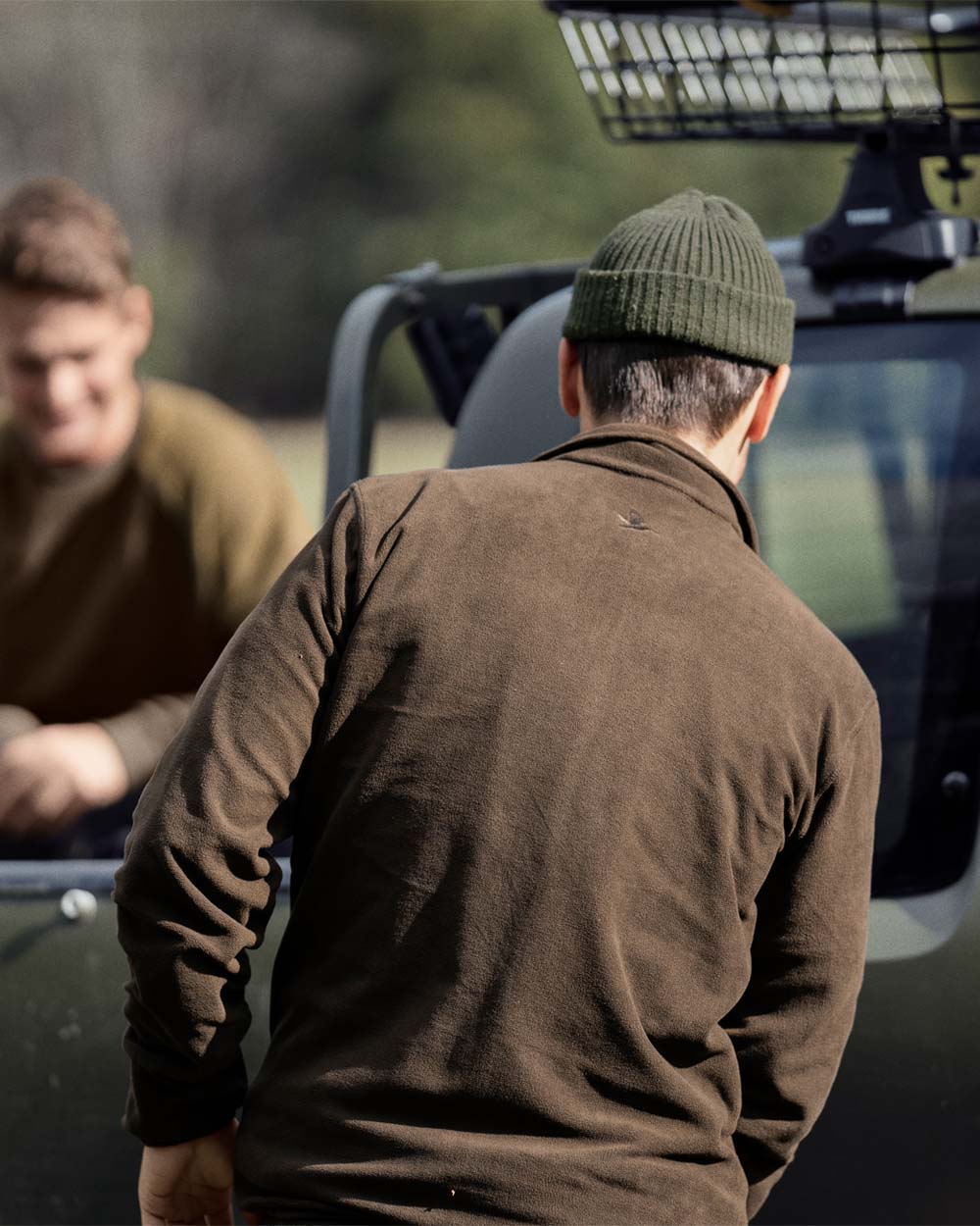 Brown Coloured Seeland Benjamin Fleece on car background 