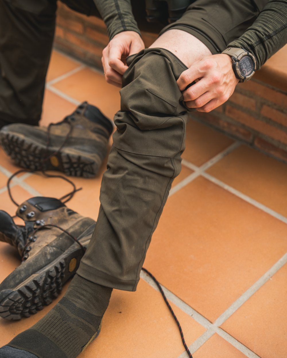 Grizzly Brown coloured Seeland Birch Zip-Off Trousers on house background 