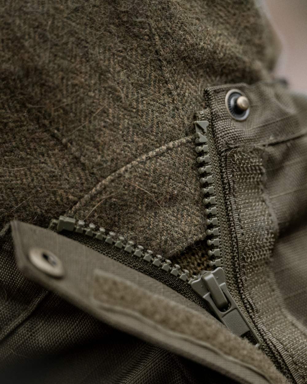 Shaded Olive coloured Seeland Buckthorn Duro Gaiters on forest background 