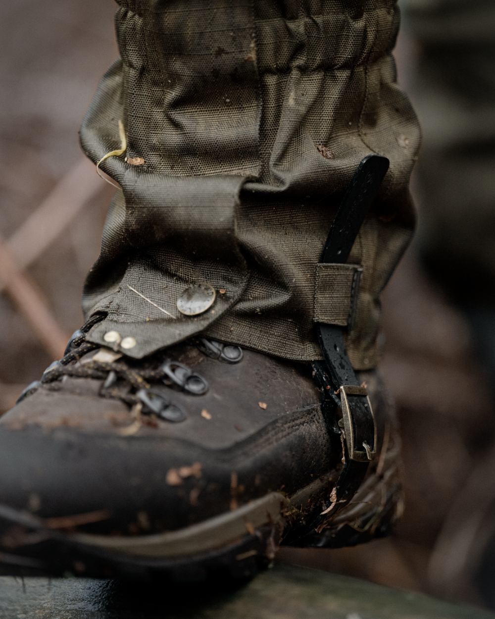 Shaded Olive coloured Seeland Buckthorn Duro Gaiters on forest background 