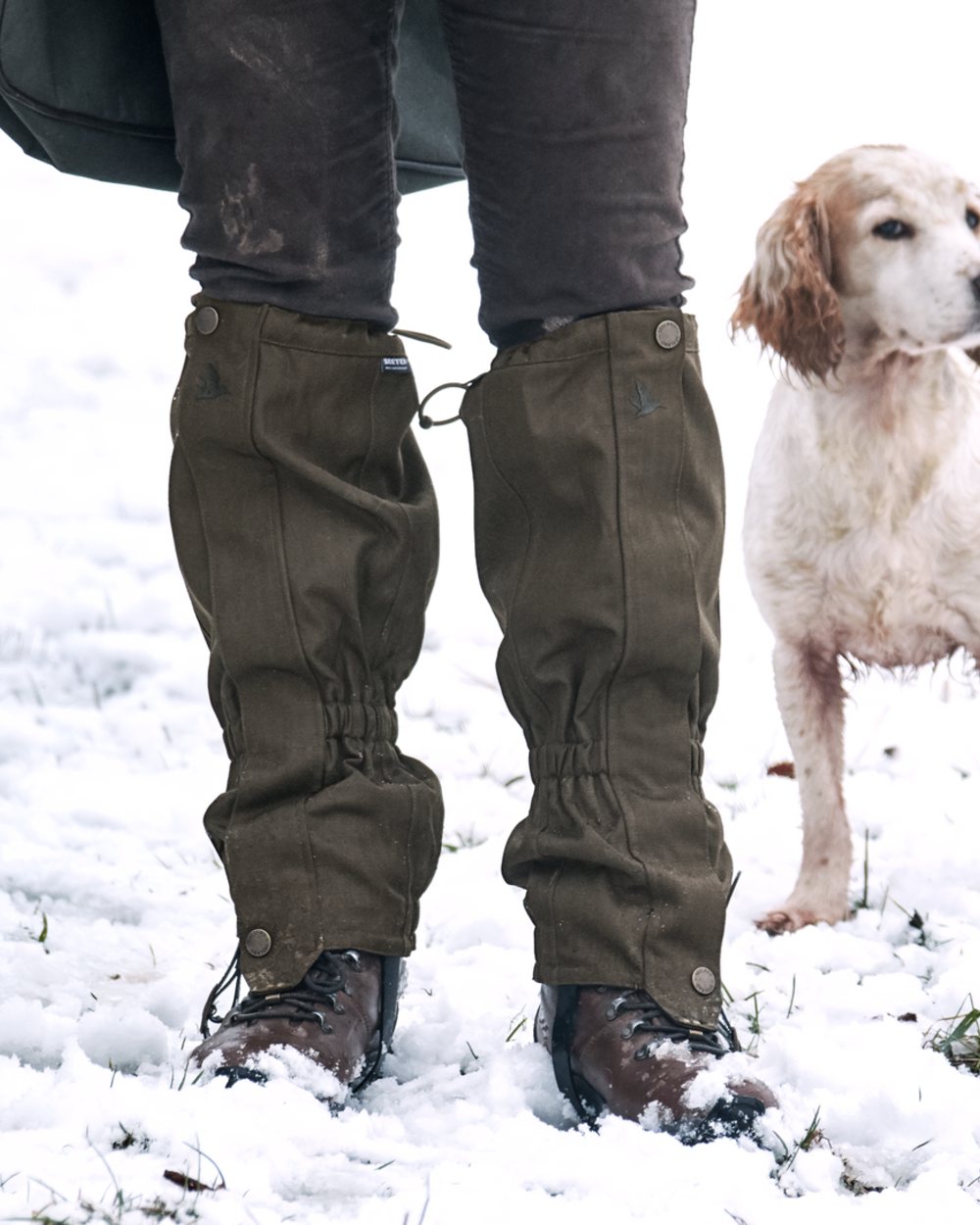 Shaded Olive Coloured Seeland Buckthorn Gaiters on snow background 