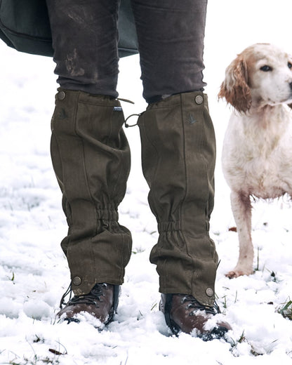 Shaded Olive Coloured Seeland Buckthorn Gaiters on snow background 