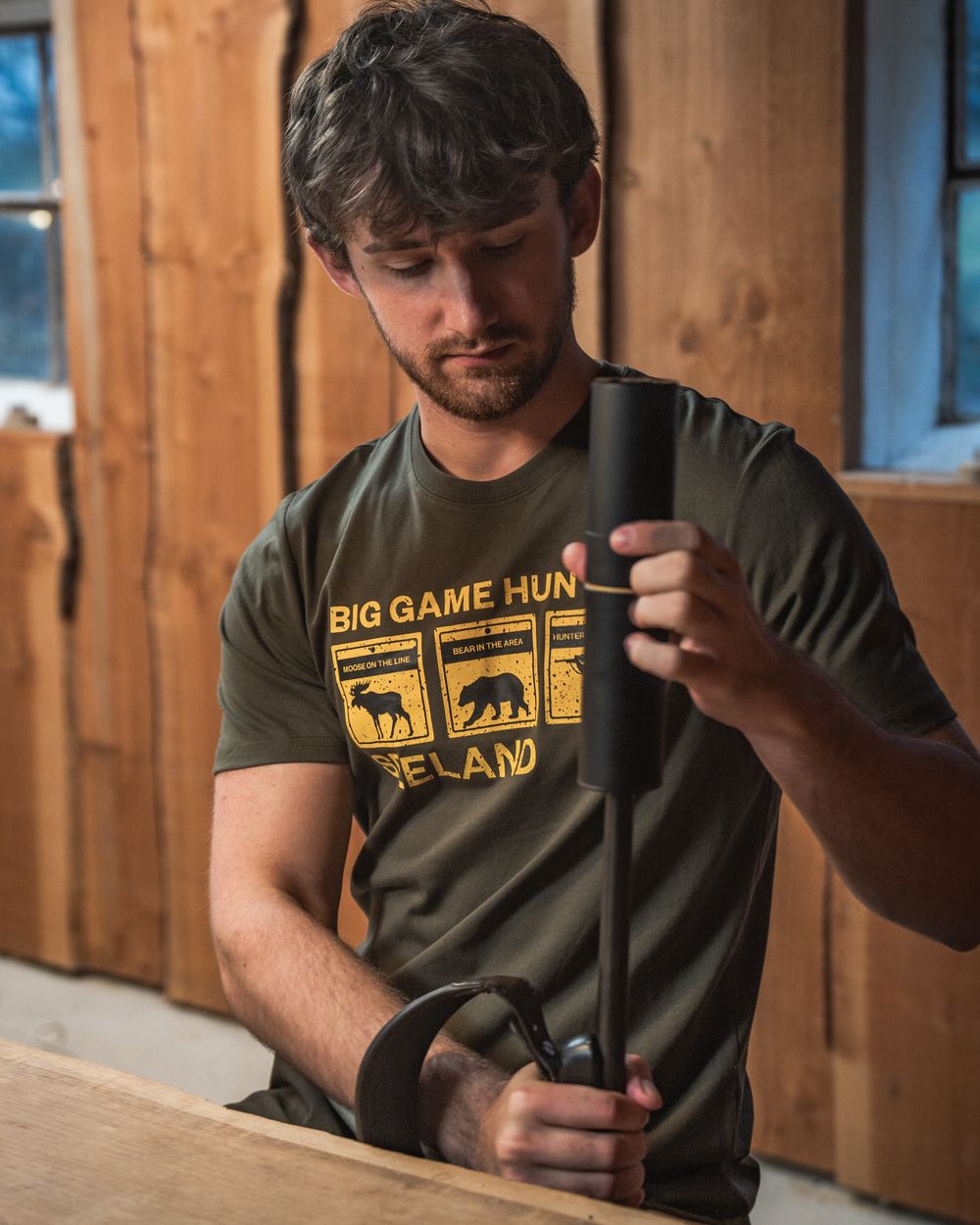 Grape Leaf Coloured Seeland Caution T-Shirt on indoor background 