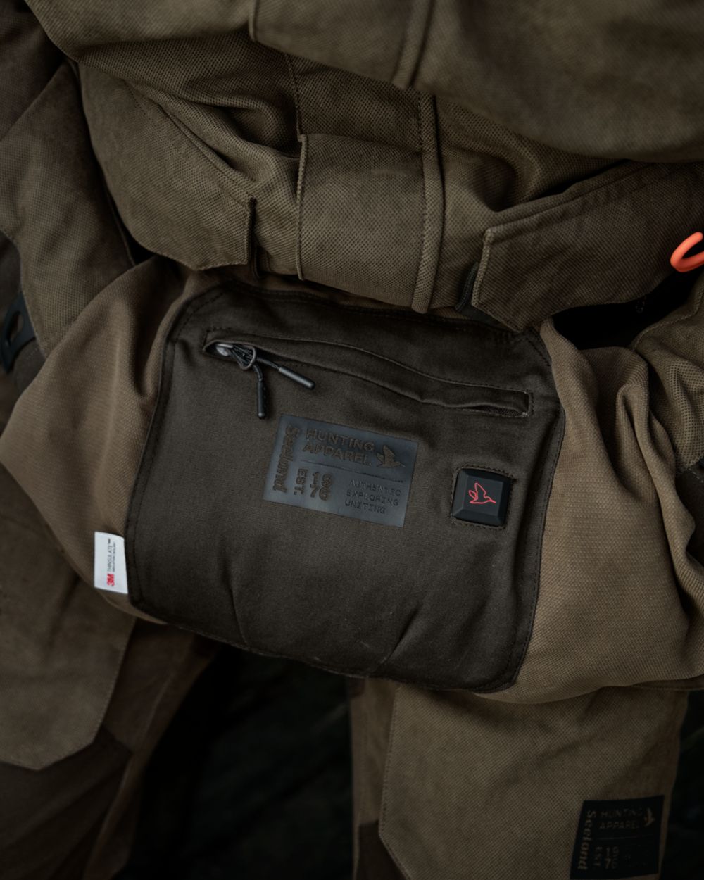 Grizzly Brown coloured Seeland Celsius Heat Muff on outdoor background 