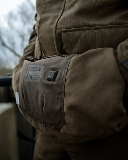 Grizzly Brown coloured Seeland Celsius Heat Muff on outdoor background 