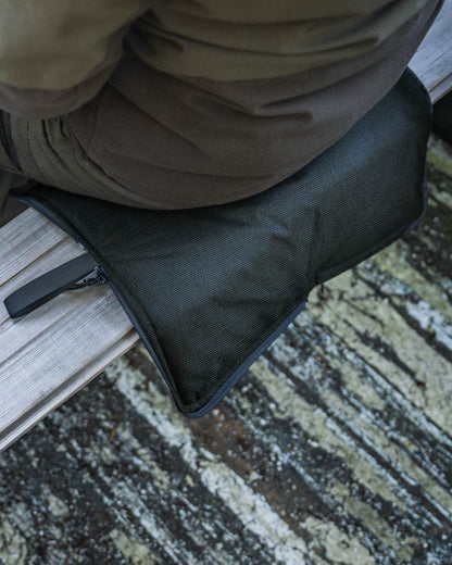 Pine Green coloured Seeland Celsius Heat Seat Pad on forest background 