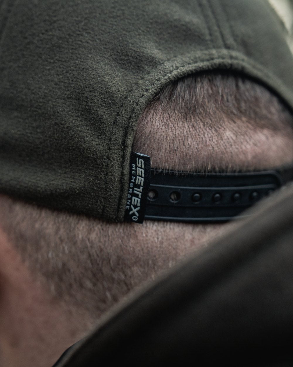 Pine Green coloured Seeland Chaser BGH Cap on forest background 