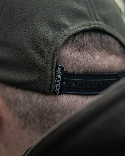 Pine Green coloured Seeland Chaser BGH Cap on forest background 